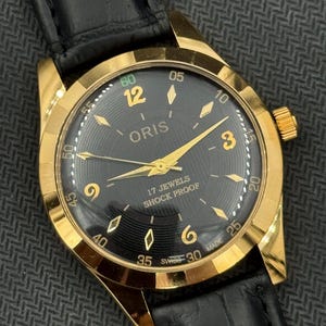 Raro orologio da polso da uomo Oris Vintage New Look con quadrante nero, cassa in oro, carica manuale, movimento FHF ST-96, svizzero