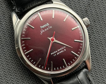 Reloj de pulsera para hombre HMT Janata vintage con esfera granate, mecanismo de cuerda manual y 17 joyas.