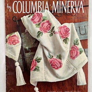 May include: A book cover for a crochet pattern book titled "Afghans by Columbia Minerva". The cover features a crocheted afghan with a floral design and tassels. The book is priced at $1.00 and has the number 742 on the cover.