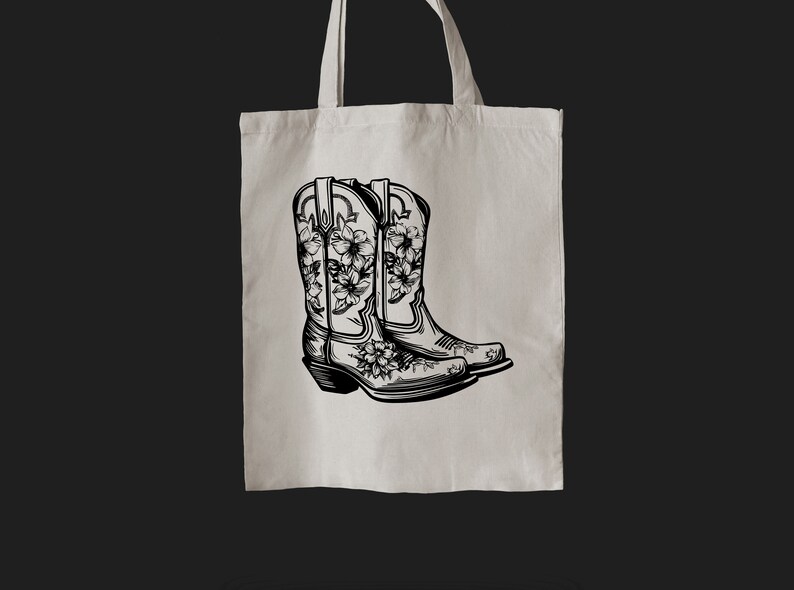 May include: A tote bag with a black and white illustration of two cowboy boots with floral designs.