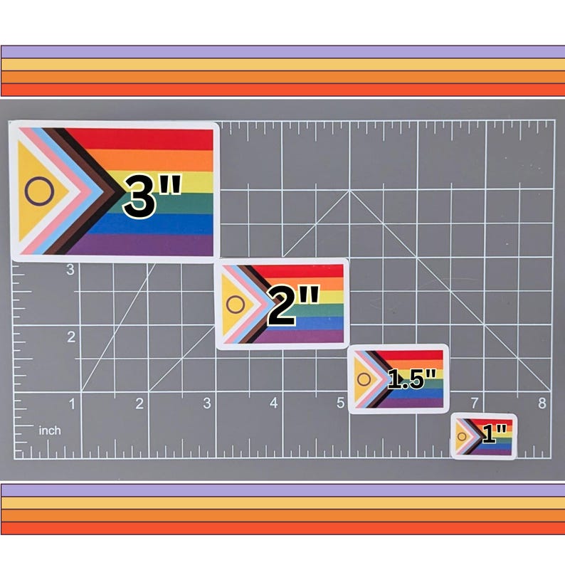 May include: Four different sizes of a pride flag sticker with a black, brown, light blue, pink, white, yellow, green, and blue color scheme. The stickers are 3 inches, 2 inches, 1.5 inches, and 1 inch in size.
