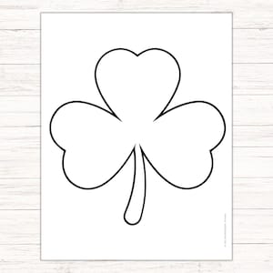 May include: A black and white outline of a shamrock, a three-leaf clover, a traditional Irish symbol.