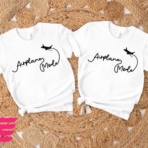 two t - shirts with the names of two people on them