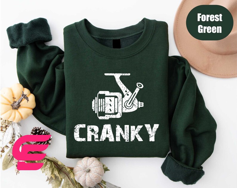 a green shirt with the words cranky printed on it