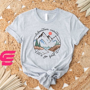 a t - shirt with a mountain scene on it