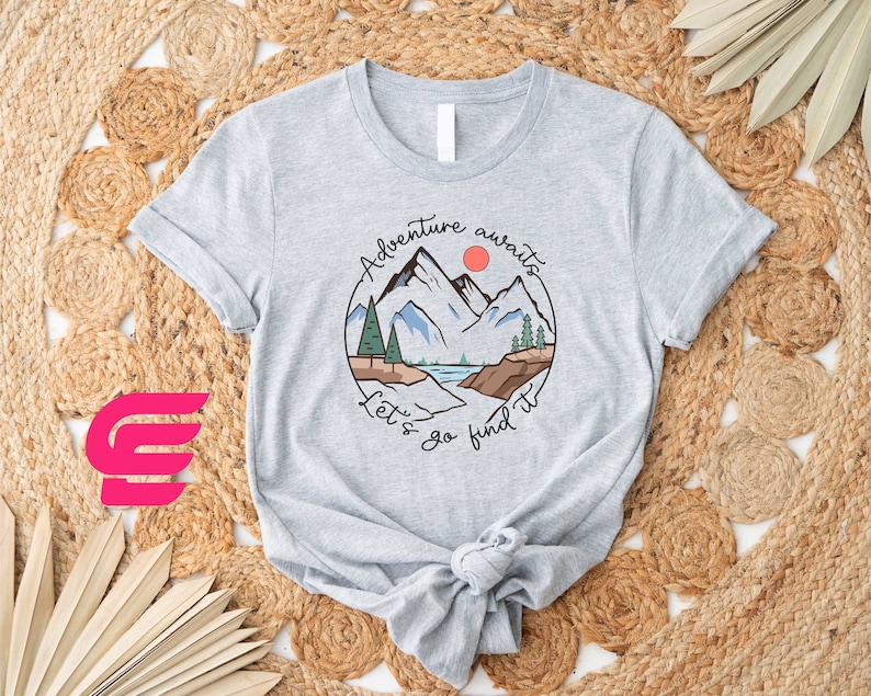a t - shirt with a mountain scene on it