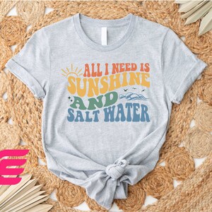 a t - shirt that says, all i need is sunshine and salt water