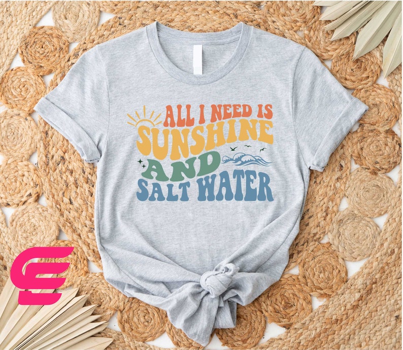 a t - shirt that says, all i need is sunshine and salt water