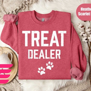 a red sweater with the words treat dealer on it