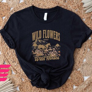 a t - shirt that says wild flowers and wild horses