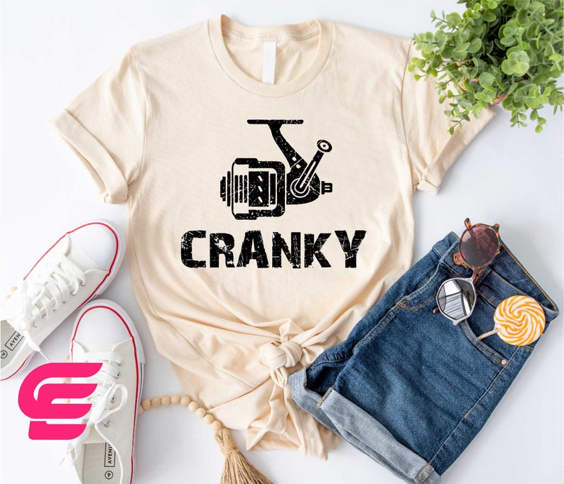 a t - shirt that says cranky next to a pair of shorts