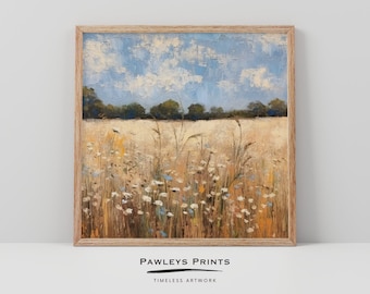 May include: A framed painting depicting a field of wildflowers with a blue sky and white clouds in the background. The painting is presented in a light wood frame.