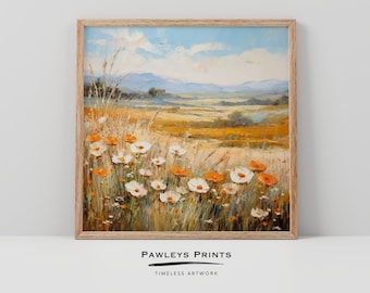 May include: A painting depicting a field of white and orange wildflowers with a distant mountain range in the background. The sky is blue with white clouds. The painting is framed in a light wood frame.