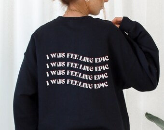 May include: Black sweatshirt with the text "I WAS FEELING EPIC" repeated four times in white with a red outline.