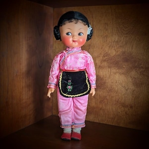 Vintage Oriental Doll with Rubber Face and Hands, Hand Painted Facial Features, with Pink Outfit and Black Floral &quot;apron&quot; and Red Shoes-12&quot;