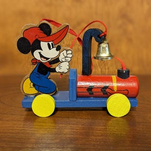 Walt Disney Wooden Engineer Mickey Mouse on Blue and Red Train Engine with Candy Cane on Bell Christmas Tree Ornament
