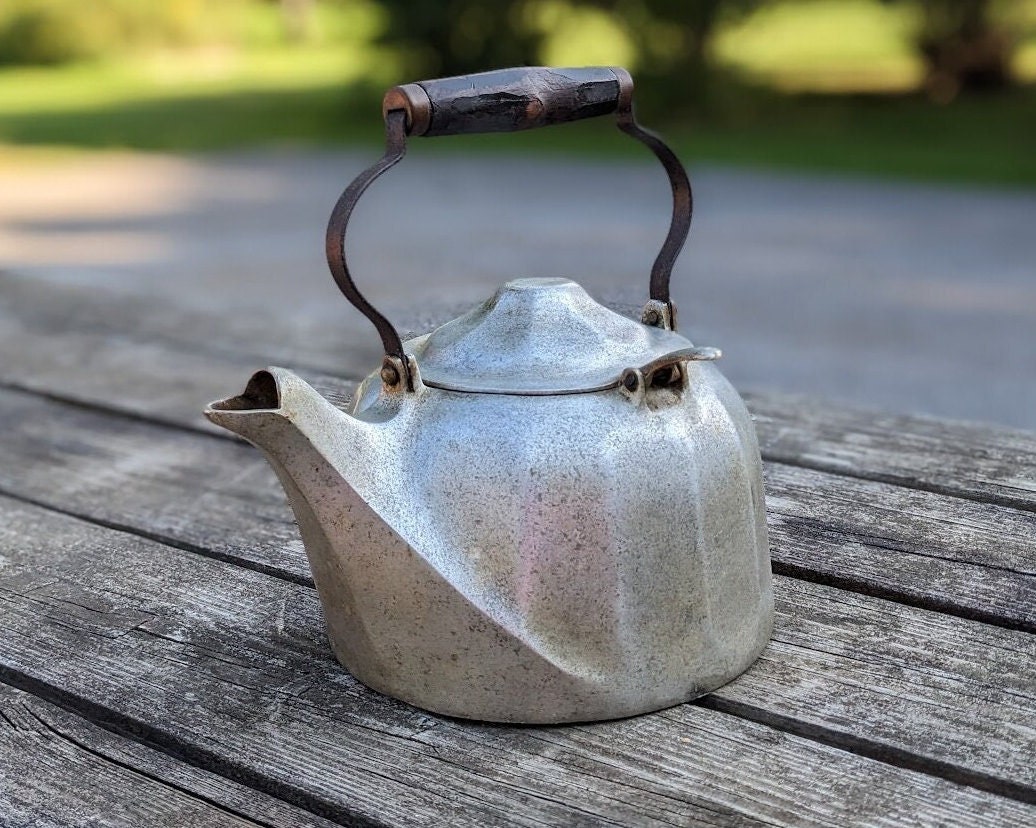Vintage large aluminum tea pot kettle stove top isolated Stock