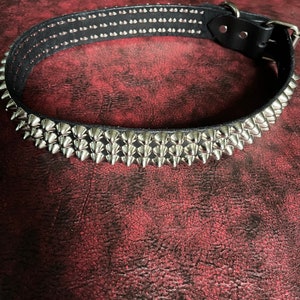 Studded triple row belt