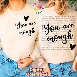May include: A beige sweatshirt with the text "You are enough" in black lettering. The text is surrounded by a black heart on the left and a black heart on the right. The text "Digital Download" is in yellow lettering on the bottom of the image.