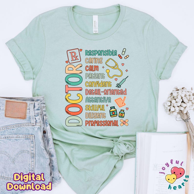 May include: A light green t-shirt with the word "DOCTOR" spelled vertically in colourful letters. The word is surrounded by words describing the qualities of a doctor, such as "responsible", "caring", "calm", "patient", "confident", "detail-oriented", "attentive", "skillful", "diligent", and "professional".