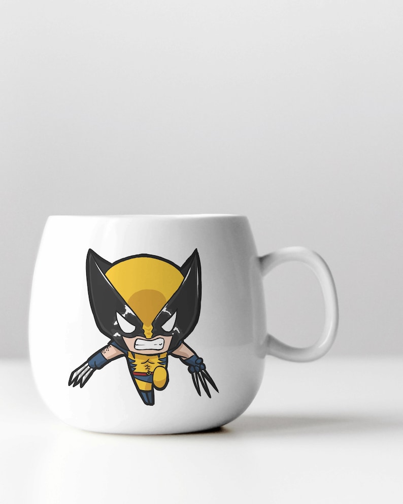 May include: White ceramic mug with a cartoon image of Wolverine, a superhero with yellow and black costume, claws, and a fierce expression.