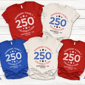 May include: A collection of five short-sleeved t-shirts in red, white, and blue. Each shirt features the text "JOHNSON FAMILY 250 CELEBRATION SAVANNAH, GA 2026" in a circular design with stars.
