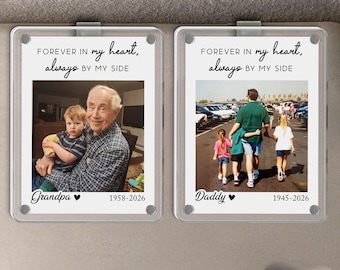 May include: Two rectangular photo visor clips. Each clip has a photo and text. The left clip says "Forever in my heart, always by my side" with a photo of a man and child. The right clip says the same with a photo of a man and two children.