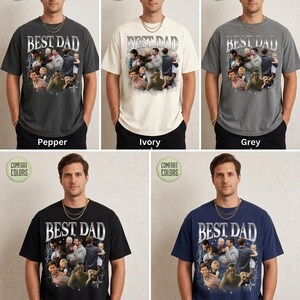May include: A collection of t-shirts in various colors, including pepper, ivory, grey, black, and navy. Each shirt features the text "BEST DAD" in a silver, metallic font, along with a collage of family photos. The shirts are labeled "Comfort Colors".