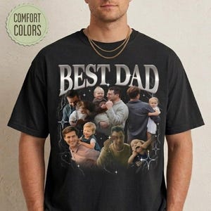 May include: Black t-shirt with the text "BEST DAD" in a silver, stylized font. The shirt features a collage of photos of fathers with their children. The words "COMFORT COLORS" are in a green circle in the upper left.