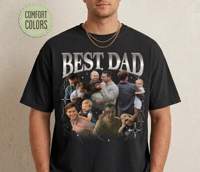 May include: Black t-shirt with the text "BEST DAD" in a silver, stylized font. The shirt features a collage of photos of fathers with their children. The words "COMFORT COLORS" are in a green circle in the upper left.