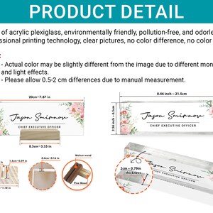 May include: A white acrylic desk nameplate with a floral design and the text "Jason Smirnov, Chief Executive Officer". The nameplate is 8.46 inches long and 2.56 inches wide. It is sitting on a wooden stand.