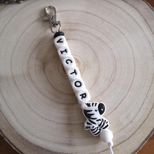 Porte clé perle silicone zèbre ,personnalisable avec un prénom,superbe idée cadeau