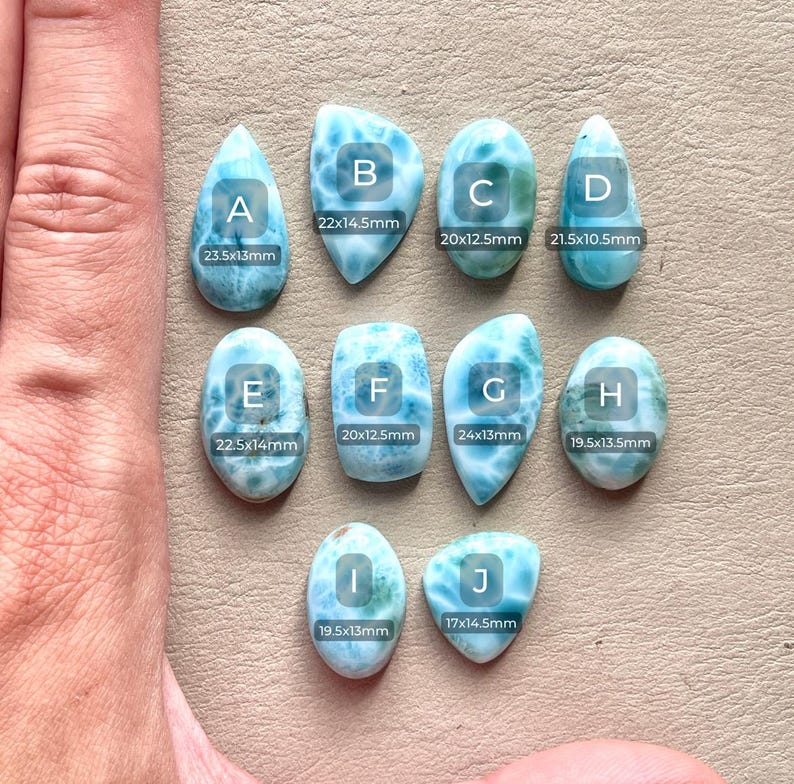 May include: Ten different sizes of blue and green gemstone cabochons, labeled with letters A through J. Each cabochon has a unique pattern and is measured in millimeters.