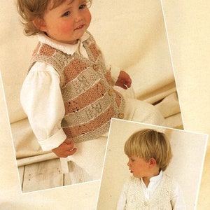 May include: Two children wearing knitted vests. The vest on the left is beige and pink with a striped pattern. The vest on the right is white with a textured pattern.