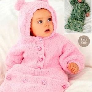 May include: A pink knitted baby sleeping bag with a bear hood and button fastening. The sleeping bag is made with a soft, fluffy yarn. Easy Knit.