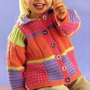 May include: A colorful knitted cardigan for a child, featuring a patchwork design with orange, purple, green, and pink squares. The cardigan has a button closure and a collar.