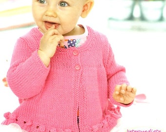 May include: A pink knitted baby cardigan with a button closure and a scalloped hem. The cardigan is made with a soft yarn and has a simple, classic design.
