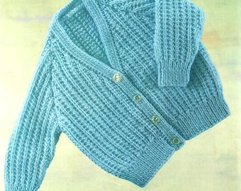 May include: A light blue knitted cardigan with a V-neck and button closure. The cardigan has a textured stitch pattern and long sleeves.