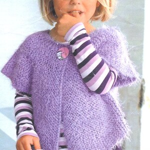 May include: A purple fuzzy knit cardigan with a button closure and striped long sleeves. The cardigan is worn by a young person with blonde hair.