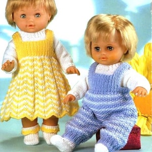 May include: Two knitted doll outfits, one yellow and white striped dress and one blue and white striped overalls. The dolls are not included.