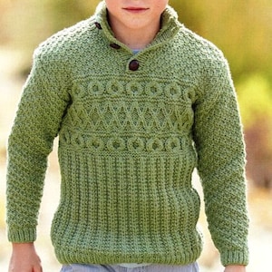 May include: A green knitted sweater with a buttoned collar and a textured pattern. The sweater has a ribbed design on the bottom and sleeves.