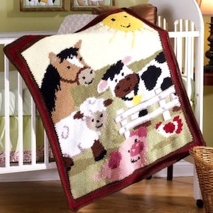 May include: A handmade, square baby blanket featuring a farm scene. The blanket depicts a horse, cow, sheep, pig, and a smiling sun. The border is a dark red, and the background is a light green.