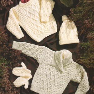 May include: Two cream-colored knitted sweaters with a cable knit pattern. The sweater on the left has a round neck and the sweater on the right has a wide collar. A cream-colored knitted hat with a cable knit pattern is also included.