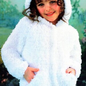 May include: A white hooded jacket with a fuzzy texture. The jacket has a zipper closure and two pockets.