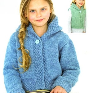 May include: A light blue knitted cardigan with a hood and button closure. The cardigan has a textured stitch pattern and is worn by a child with blonde hair. The cardigan is suitable for ages 22-32 inches.