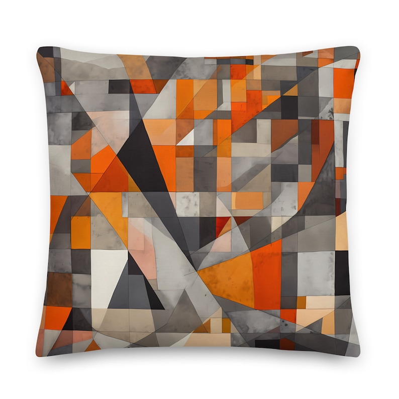 May include: Geometric pillow cover with a pattern of orange, brown, and gray squares and triangles. The pillow cover has a modern abstract design.