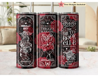 May include: Three cylindrical tumblers with metal straws featuring a dark red rose pattern and white line art. The designs include text: Morally Grey Is My Favorite Color, You Had Me At Trigger Warning, and The Smutty Book Club Lifetime Member Admit One.