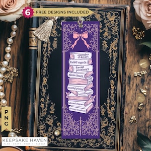 May include: A rectangular purple bookmark featuring a stack of books with the text: enemies to lovers, fated mates, forced proximity, slow burn, one bed, mutual pining, love triangle, second chance, and grumpy sunshine, topped with a pink bow.