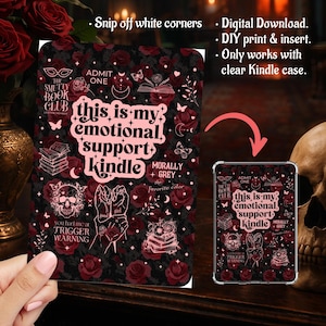 May include: A black and red Kindle skin with a floral and gothic design. The skin features the text "this is my emotional support Kindle" and other graphics. The design includes roses, butterflies, and skulls. The skin is shown next to a Kindle in a clear case.