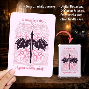 May include: A rectangular light pink digital download insert for a clear Kindle case. The design features a dark purple dragon with wings spread over a sword, surrounded by pink floral line art and the text, a chapter a day keeps reality away.